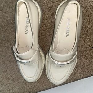 Prada Women's Ivory Loafers with Silver Accent